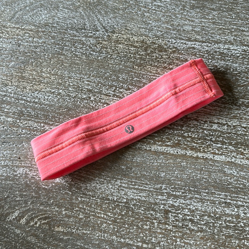 Lululemon fly away tamer headband. Good condition! Coral with pin striping